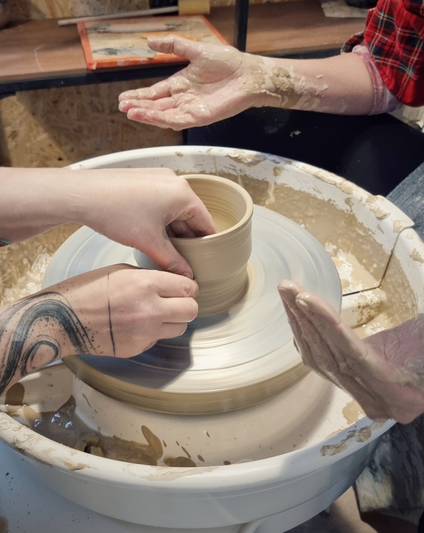 Learning to throw on a potter's wheel